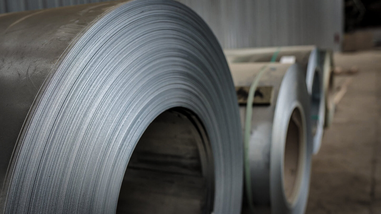 Stainless steel coils strapped to a Grid-Line flatbed