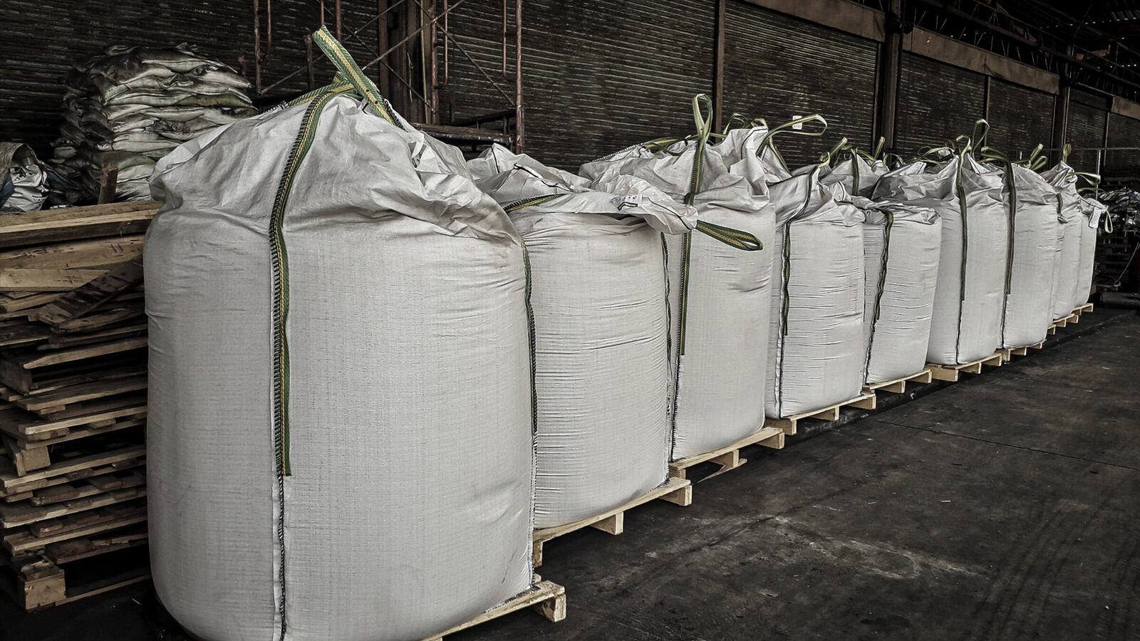 Super sacks of bulk minerals staged on pallets